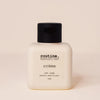 Bottle of 'routine.' cat lady shampoo on a beige background