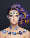 Creative Makeup by Saskatoon Makeup Artist Jennilee Cardinal Schultz. Photo by Bill Hamilton. Woman with floral face and body paint against a dark background