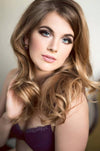 Glam Makeup by Saskatoon Makeup Artist Jennilee Cardinal Schultz on Alina Mcleod. Photo by Diane Heron. Woman with styled hair and makeup against a neutral background