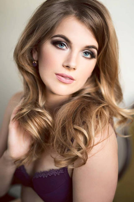 Glam Makeup by Saskatoon Makeup Artist Jennilee Cardinal Schultz on Alina Mcleod. Photo by Diane Heron. Woman with styled hair and makeup against a neutral background