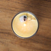top view of lit luxury cancer zodiac crystal infused intention candle