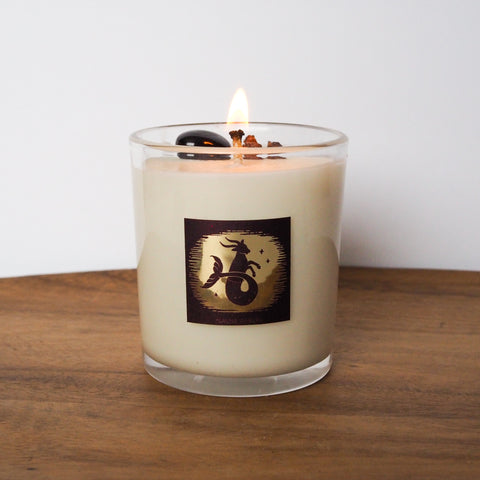 lit luxury capricorn zodiac crystal infused intention candle