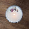 top view of lit luxury gemini zodiac crystal infused soy intention candle