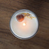 top view of lit luxury leo zodiac crystal infused soy intention candle