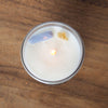 top view of lit luxury pisces zodiac crystal infused soy intention candle