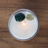 top view of lit luxury taurus zodiac crystal infused soy intention candle