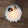 top view of lit luxury virgo zodiac crystal infused soy intention candle