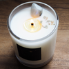 top view of lit luxury waning moon crystal infused soy intention candle